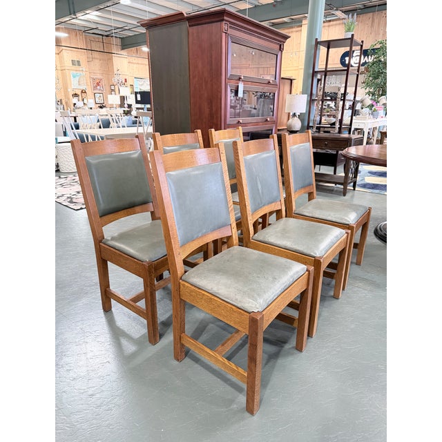 A handsome set of six Stickley upholstered cottage dining chairs reflecting the enduring craftsmanship and timeless design...