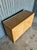 A beautifully crafted vintage coastal credenza showcasing refined split reed detailing across both door fronts, framed by...