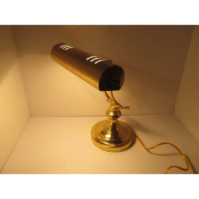 Classic vintage Mid-Century Modern adjustable Bankers-style piano desk lamp featuring a timeless design and functional...
