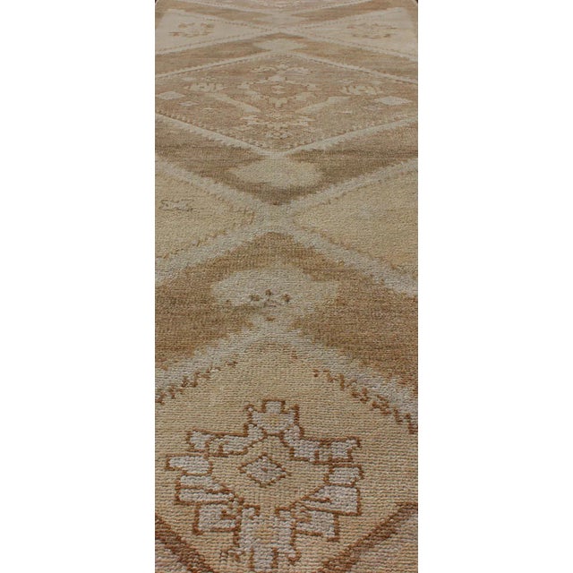 Mid 20th Century Vintage Turkish Oushak Runner Neutral and Warm Colors With Tribal Medallions For Sale - Image 5 of 13