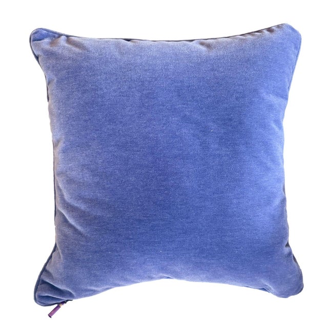 This spring inspired pillow features a flower motif and wavy chevron pattern with a bluish-purple velvet backing and welt....