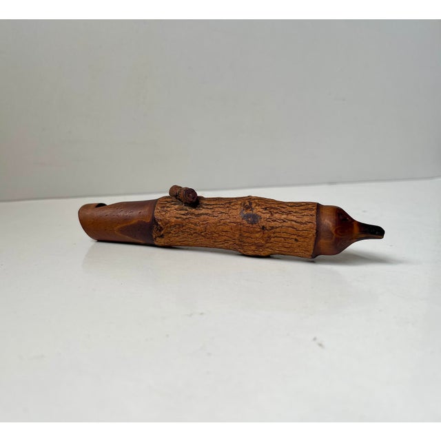 Artisan made folk art piece in the shape of this charming little whistle. Hand-carved in rustic fruitwood and featuring...
