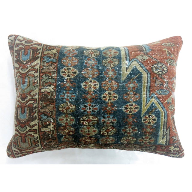 A large decorative pillow made from a a persian mazlagan malayer antique rug 16'' x 16''