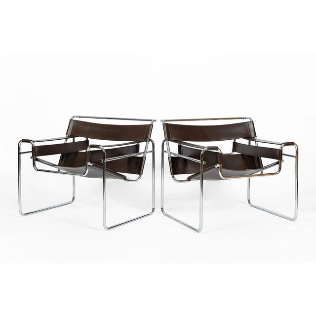 This pair of vintage mid-century modern Wassily lounge chairs designed by Marcel Breuer and labeled Stendig were produced...