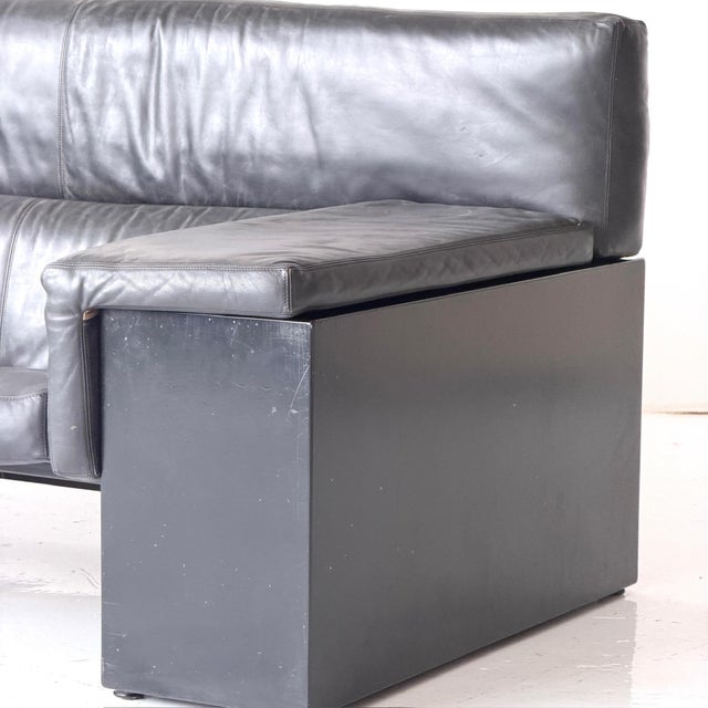 c. 1970s. Italy. Black leather upholstery with wood sides.