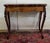 Louis xv style games table in marquetry and mahogany. it features beautiful curves and cabriole legs. the frieze is...