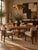Elegant vintage Biedermeier and Neoclassical-style expandable dining table crafted in warm-toned cherry wood and veneer....
