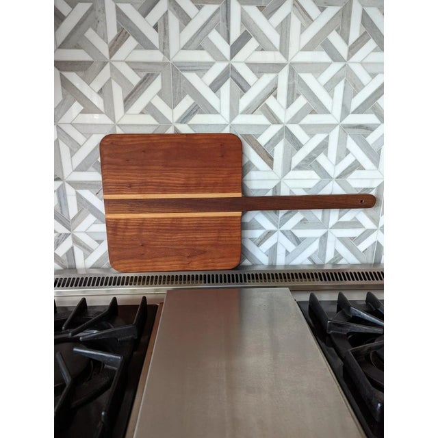 This beautiful, handcrafted pizza paddle/charcuterie board is Amish-made, from Lancaster, Pennsylvania. It features a...