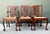 This exceptional set of six dining chairs represents a sophisticated fusion of classic 18th-century Chippendale...