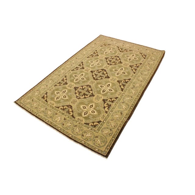 This gorgeous transitional handmade rug follows an abstract pattern which exotically repeat like a continuous reflection....