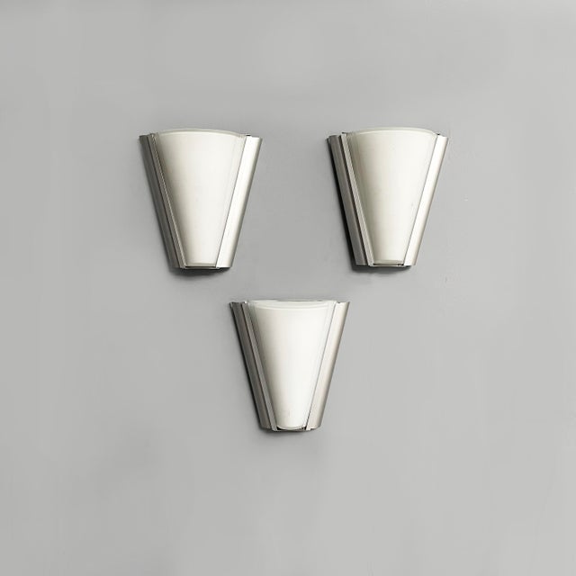 Italian modern wall lamps in opaline glass and metal, 1980s Set of three wall lamps with rounded, conical opaline glass...