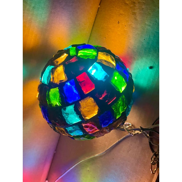 This is a fantastic brutalist style hanging globe made of large chunks of glass fragments in a multitude of colors...