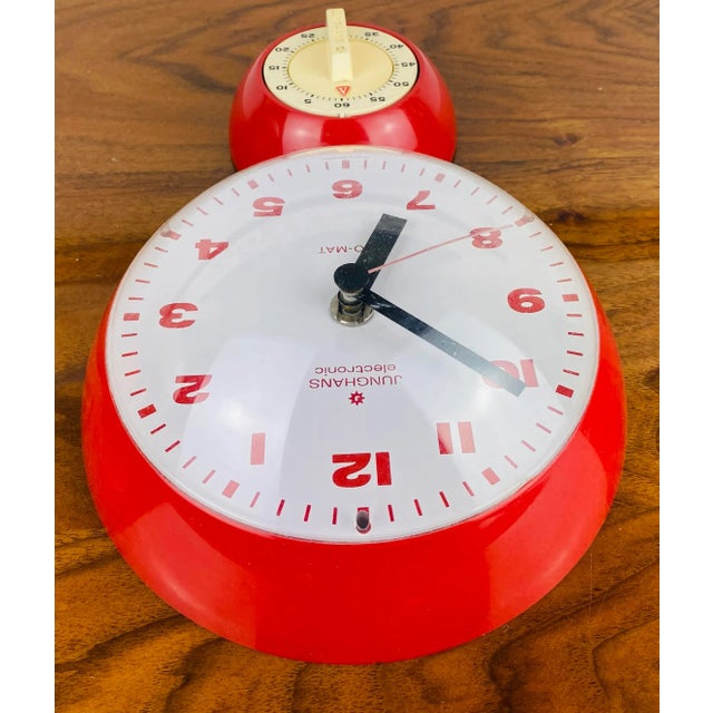 This striking Junghans wall clock in a bright red plastic case dates from the 1970s and combines striking design with...