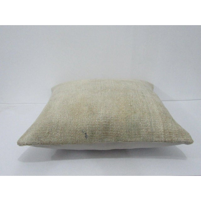 Decorative pillow cover made from a vintage Turkish handknotted rug. Backed with good quality cotton fabric. Pillow...