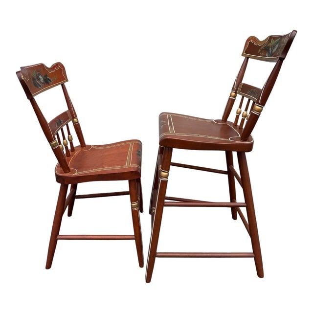 Beautiful set of two vintage hand-painted wooden chairs in a charming country folk art style. Each chair features unique...