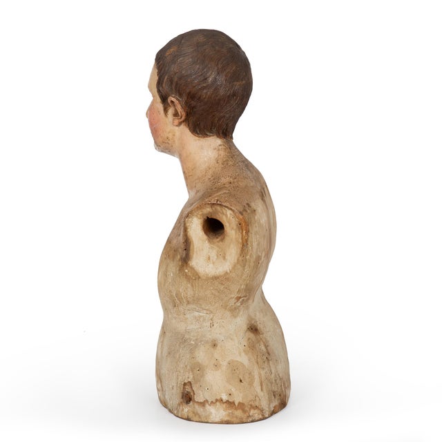 A CARVED AND POLYCHROMED WOOD FIGURE OF A YOUNG MALE SAINT Probably Southern Italy, late 18th century 26 1/8" H x 9 1/2" D...