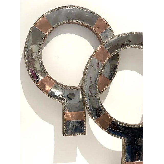 This large scale Mid-Century Modern mixed metal wall sculpture was created in the style of a piece ("Neutrality") designed...