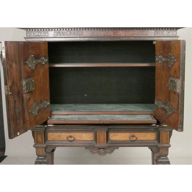 An impressive 19th-century Italian Renaissance Revival cabinet, finely constructed in walnut and richly decorated with...