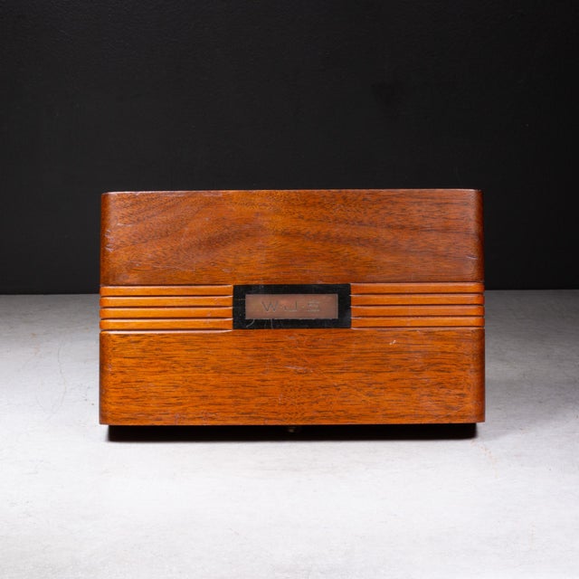 ABOUT An Art Deco domino set with 28 Bakelite dominos. Customized walnut box monogrammed with "WJS". Lined on the top and...