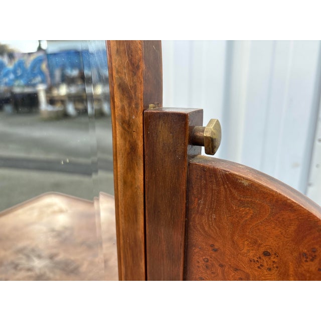 Elegant French Art Deco dressing table, dating from the 1920s–1930s, featuring a tilting mirror and a single drawer. The...