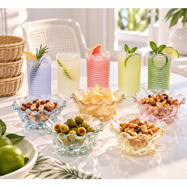 A vintage, mint-condition serving set, with 5 glasses, 5 glass snack bowls, and 5 rattan baskets for the bowls. Each glass...