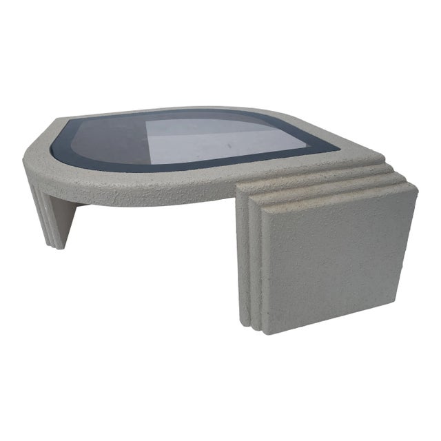 Postmodern 1980s eye shaped textured coffee table. This piece is made of solid wood with a stucco textured off white...