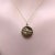 This is a precious 14k gold medallion vintage charm is handcrafted from a Victorian era button and features a portrait of...