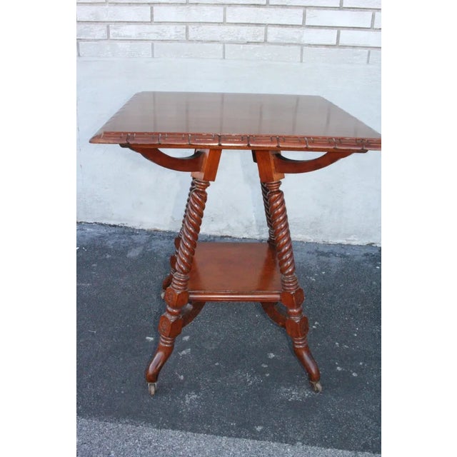 Beautiful solid walnut American made side end center occasional accent table in the George Hunzinger style, featuring a...