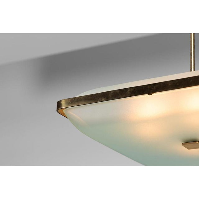 This rare Model 2026 chandelier is an outstanding example of Max Ingrand’s refined approach to geometric modernism and...