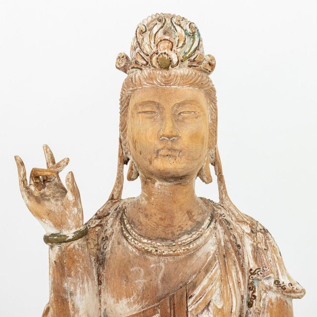 Chinese Carved Wood Standing Guanyin Sculpture, with remnants of gesso and polychrome paint. 49.5" H x 18" W x 11.5" D....
