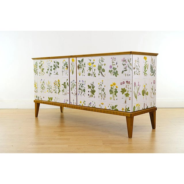 Beautiful sideboard in near mint condition. Illustrations from Nordens Flora by C.A.M Lindman, the same illustrations that...