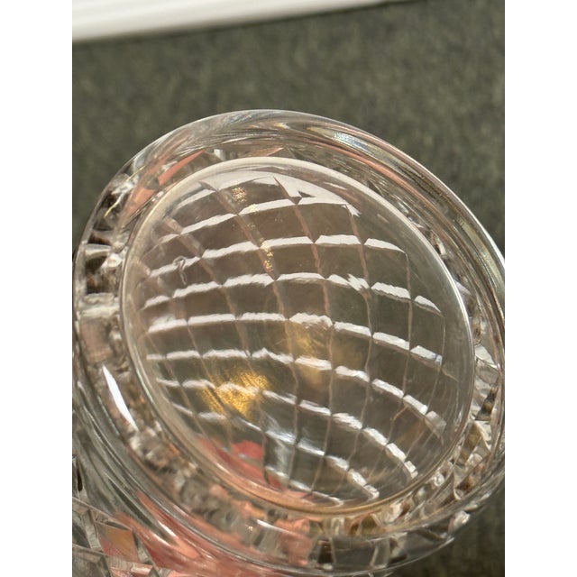 Design Plus Gallery presents a Vintage Cut Crystal Decanter. The decanter is detailed with a diamond-cut lattice pattern,...