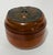 Formed as a compact, barrel-bodied string container, this Continental example is turned from a warm-toned hardwood with...