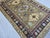 2000 - 2009 Brown and Navy Kazak Style Tribal Area Rug With Medallions, 5' X 7'7" For Sale - Image 5 of 15