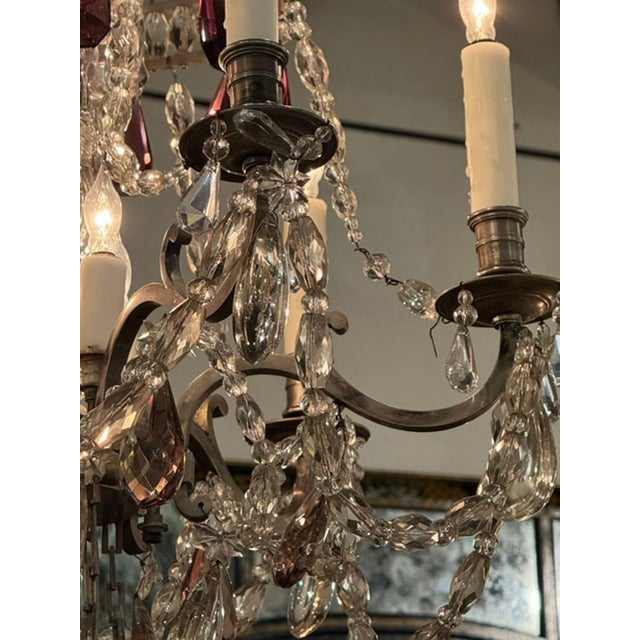 The late 19th century French silvered bronze and crystal chandelier with amethyst is a luxurious and elegant lighting...