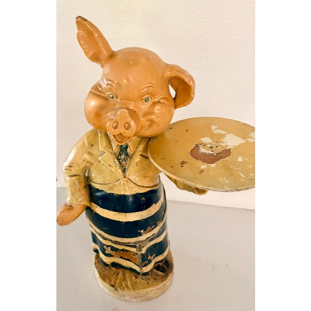 At your service! This antique plaster figure, likely from and English butchery is a rare and fascinating find. Showing an...
