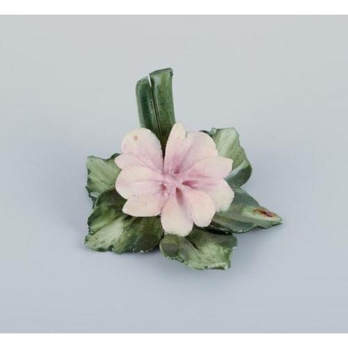 Capodimonte, Italy, a set of six porcelain table card holders shaped like water lilies. Hand-decorated. Overglaze finish....