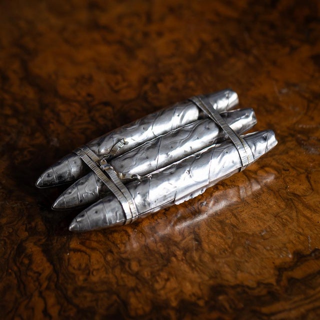 Antique 19th century american solid silver cigar case. Crafted in the form of three cigars bundled together. Each cigar is...