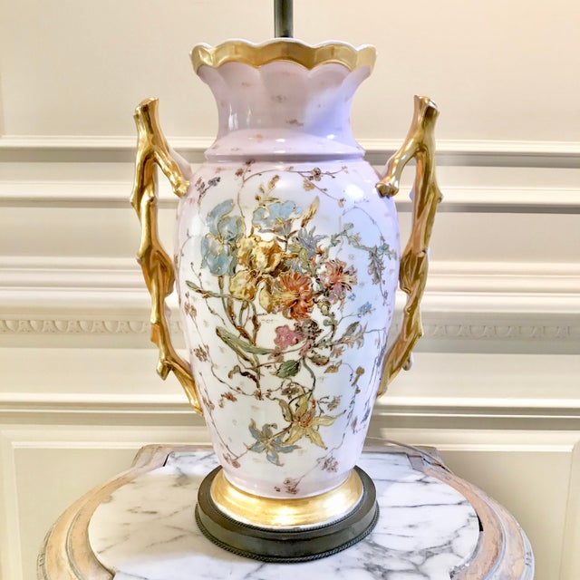 Antique porcelain vase lamp with two gold-leaf branch “arms”. Delicate floral design. Pale pink, pale blue and green, with...