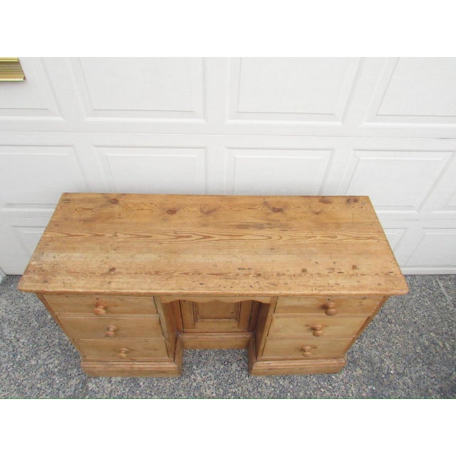 An antique English country pine six drawer buffet, c.1850 Constructed from solid natural pine with a warm honey finish...