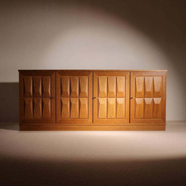 A sculptural oak sideboard by the German manufacturer Gerhard Bartels, dating back to the late 1970s (according to the...
