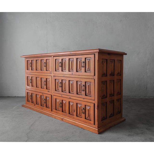 Unique rustic Spanish style cabinet in finished pine. A versatile, well made and heavy piece with a stacked, architectural...