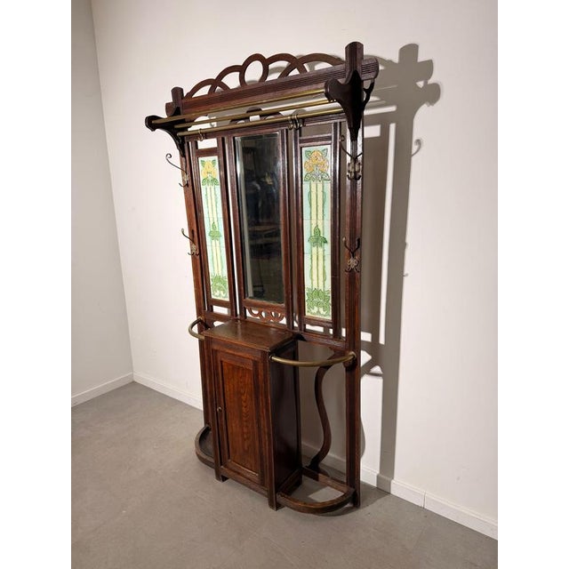Impressive antique Art Nouveau hall stand / coat rack , crafted in richly toned wood and featuring an elegant...