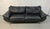 Comfortable and stylish black leather 3-seater sofa with a modern contemporary design. Features oversized cushioned...
