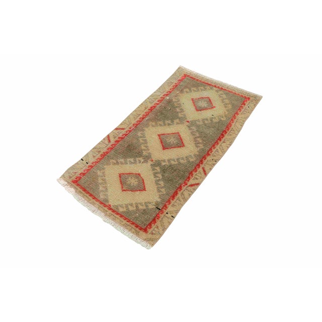 Vintage Handknotted decorative mini rug from Kars region of Turkey. Approximately 45-55 years old. In very good condition.