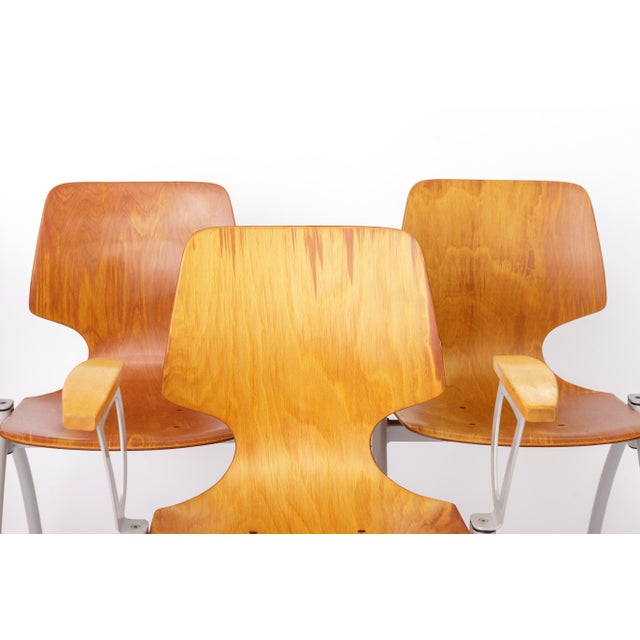 Set of 4 vintage stackable chairs from the 1970s–1980s, featuring molded Pagholz seats and backrests with solid beech wood...