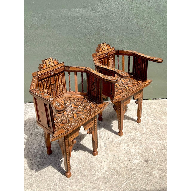 This exceptional pair of vintage Syrian armchairs showcases the centuries-old artistry of Middle Eastern furniture making...
