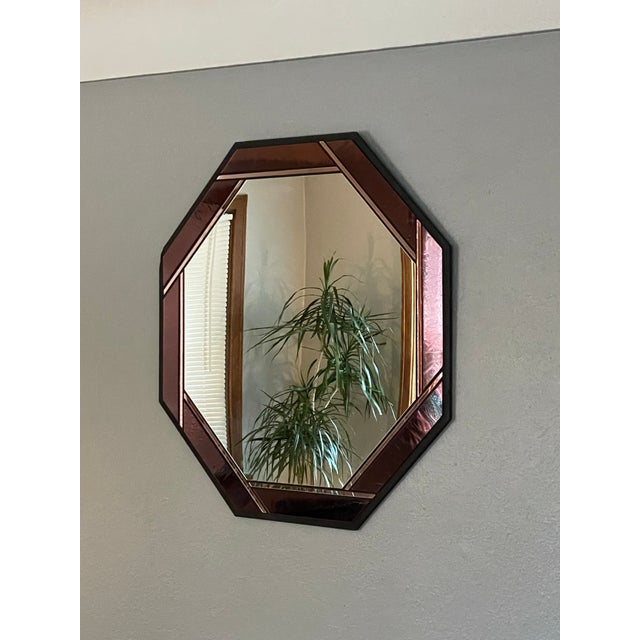 A large and beautiful stained glass mirror handcrafted by Marsha Moore in her now-closed studio in Spokane, Washington....