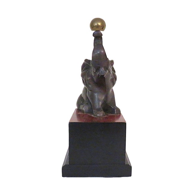 FREE SHIPPING ANYWHERE IN THE CONTINENTAL US! This is a set of vintage bookends featuring playful elephants with their...