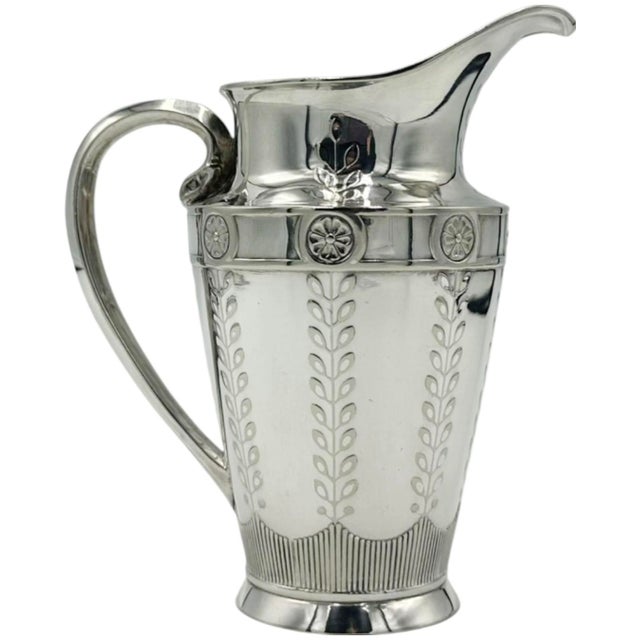 Details: -This beautiful pitcher has a lovely floral embossed pattern -Approx. Dimensions: 5.5"H x 5" x 2"D -*Please feel...